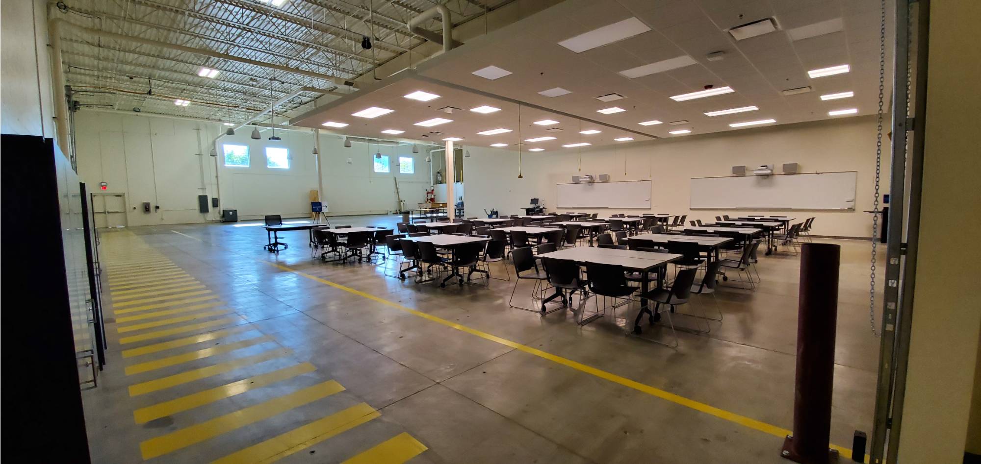 A view of K-12 outreach center set up with pod style seating